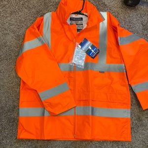 Rain jacket with roll up hood in collar